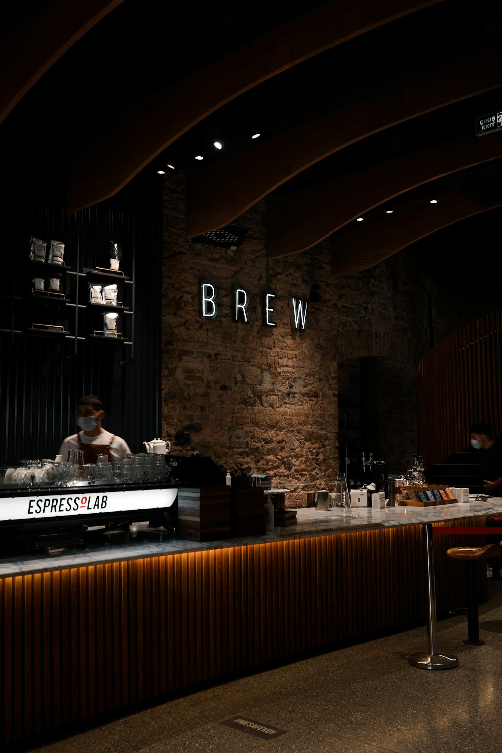 Barista preparing an order behind a busy counter